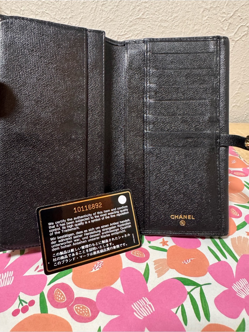 CHANEL Black Quilted Leather Wallet Phone Case with Gold Logo